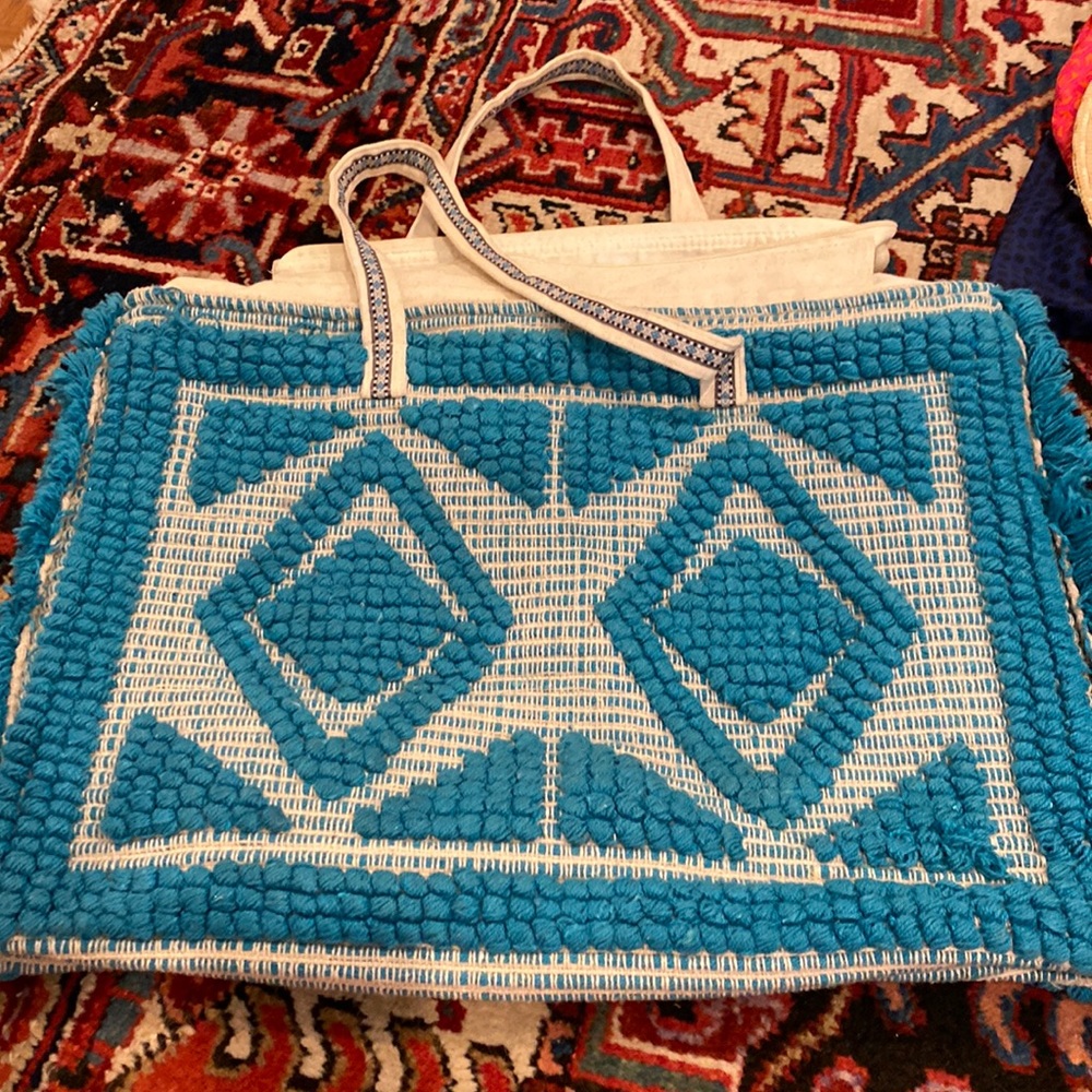 Turquoise woven tote bag for travel, beach, pool.